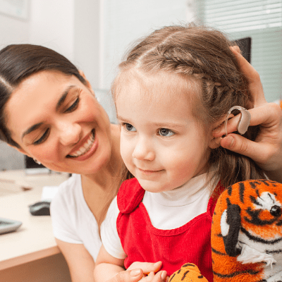 dr and child with hearing aids 2