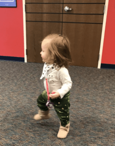 a child holding a toy sword